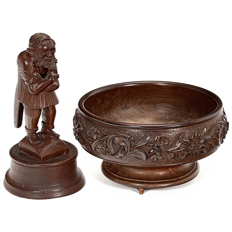 2 Carved Black Forest-Style Musical Table Items, Early: 2 Carved Black Forest-Style Musical Table Items, Early 20th Century 1) Nut-cracker modeled as an dwarf with articulated mouth, on circular base stamped "Switzerland", with single-air musical movement,