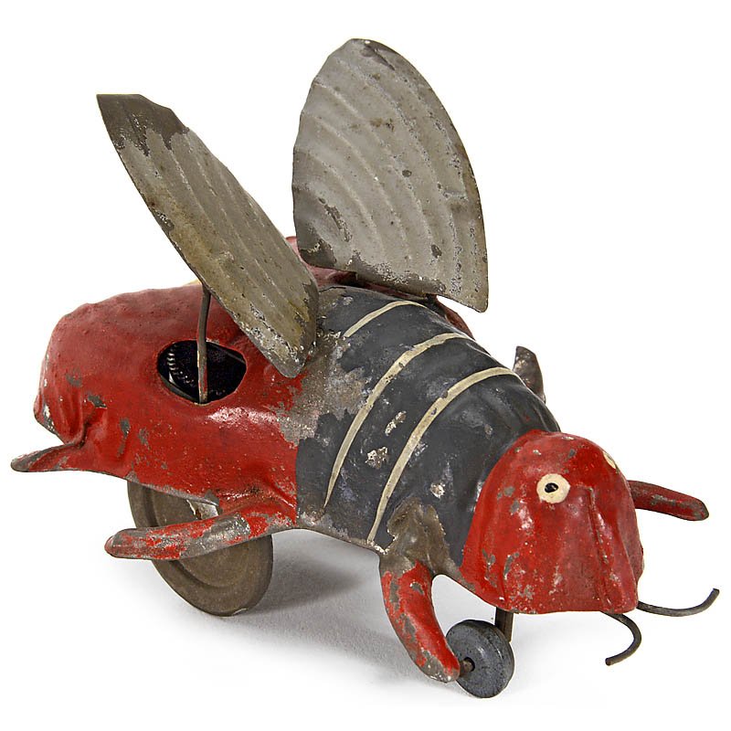 Günthermann Tin Toy Figure "Flittering Bee": Günthermann Tin Toy Figure "Flittering Bee" Clockwork-driven, hand-painted tin, moving wings, length 4 1/3 in., working. Günthermann-Figur "Flatternde Biene" Mit Federwerk, handlackiertes Blech, be