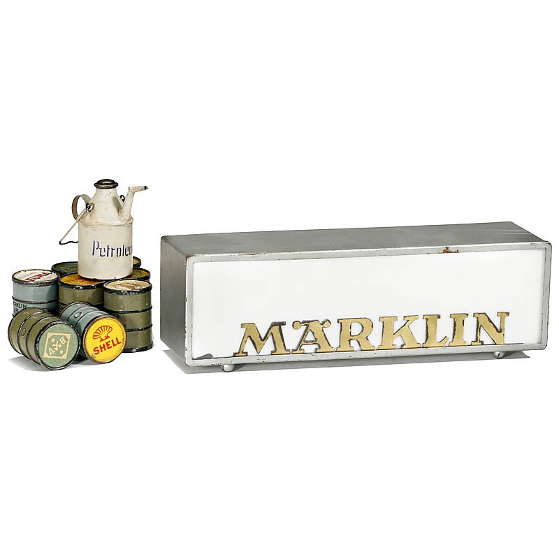 Lot of Märklin Parts, from 1925: Lot of Märklin Parts, from 1925 1) Advertising sign, missing backdoor, length 9 7/8 in. – 2) 8 petrol barrels. – And: 3) Petrol can, height 2 ½ in. Diverse "Märklin" Teile, ab 1925 1) Werbeschi