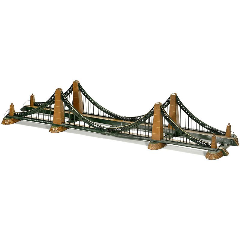 Märklin Suspension Bridge No. 2514/1, Gauge I, c. 1930: Märklin Suspension Bridge No. 2514/1, Gauge I, c. 1930 Hand-painted tin, can be dismantled in 2 parts, overall length 43 2/3 in.! Very good original condition. An impressive building. Eisenbahn-Häng