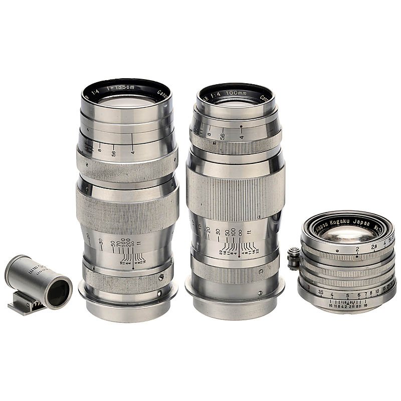 3 Nikon and Canon Screw-Mount Lenses: 3 Nikon and Canon Screw-Mount Lenses 1) Canon Camera Co., Japan. Serenar 4/100 mm, 1948. (3+/3) – 2) Serenar 4/13,5 cm, 1949, with Canon 135 mm finder. (3/3) – And: 3) Nippon Kogaku, Japan. Nikkor