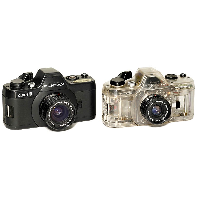 2 Pentax auto 110, 1979: 2 Pentax auto 110, 1979 Asahi Pentax, Japan. 1) Pentax auto 110, black, 2,8/18mm lens. – And: 2) Pentax auto 110, transparent model, 2,8/24mm lens, working demo model. 2 Pentax auto 110, 1979 Asahi 