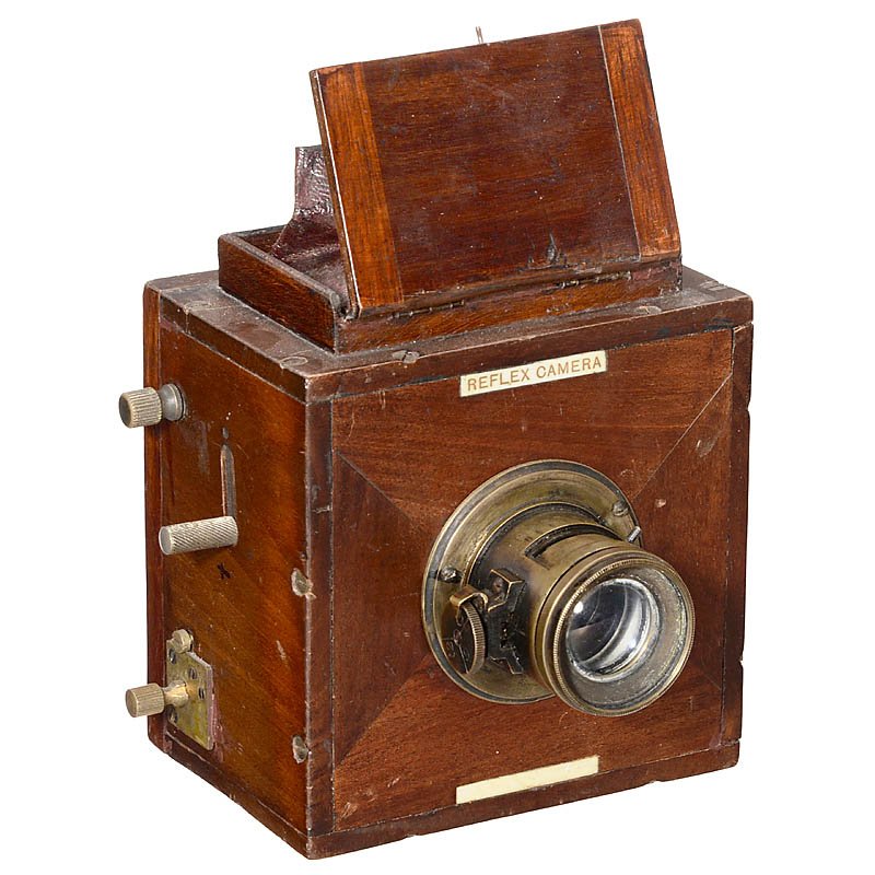 Miniature "Reflex Camera", c. 1900: Miniature "Reflex Camera", c. 1900 Presumably England. SLR camera for plates with size 4 x 6 cm, tropical wood, focal plane shutter (needs attention), brass lens 1:6, rack-and-pinion focusing (stuck),