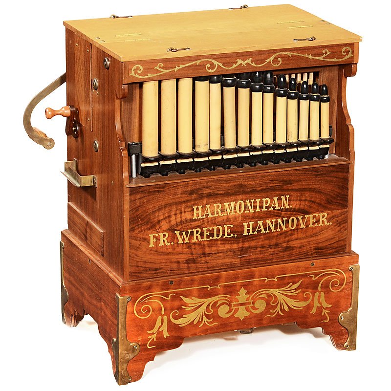 Harmonipan Paper Roll Organ: Harmonipan Paper Roll Organ Signed: "Harmonipan Fr. Wrede Hannover", 25/26 notes, double-register, with double pan pipes and bass pipes, size 19 x 13 x 25 in., with 6 rolls, good playing condition. Ha