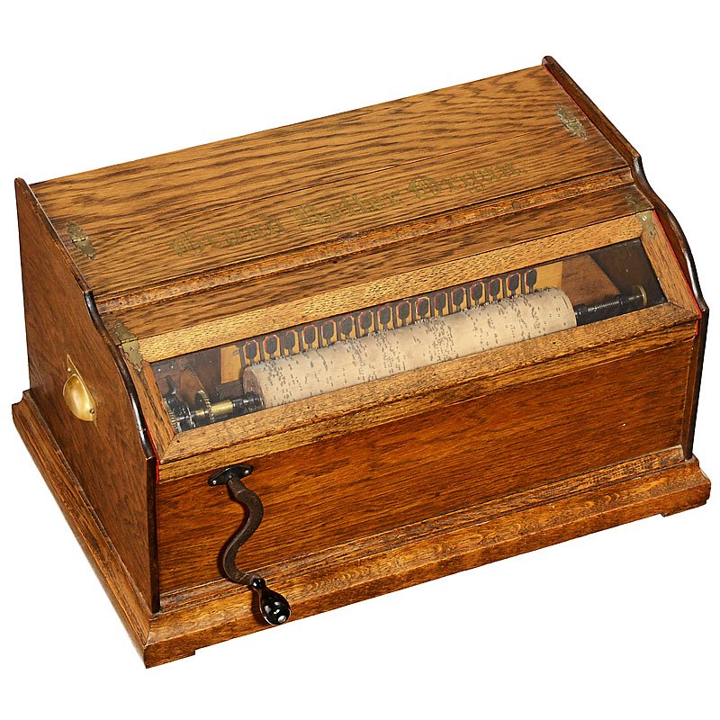 Rare Autophone Co. "Grand Roller Organ", c. 1906: Rare Autophone Co. "Grand Roller Organ", c. 1906 For 13 ¼ in. (34 cm) spirally-pinned wooden cylinders, with 32-note action, crank and oak case, width 23 ½ in. (64 cm), with 14 cylinders. – The la