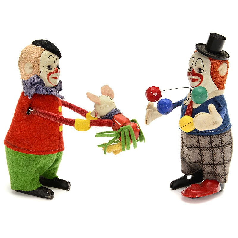 2 Schuco Clockwork Dancing Figures, c. 1950: 2 Schuco Clockwork Dancing Figures, c. 1950 Mechanical clowns, tin, cloth and felt, height 5 ½ in. each, juggler (1 shoe missing) and clown with mouse, working. 2 Schuco Tanzfiguren, um 1950 Mechanis