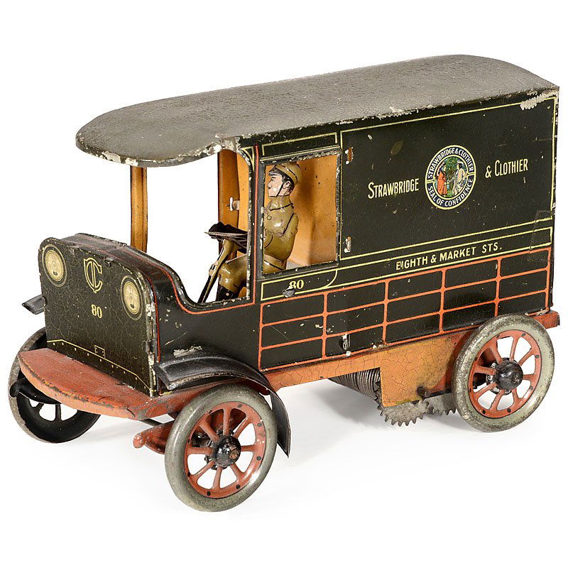 Hans Eberl "Strawbridge & Clothier" Delivery Van, c.: Hans Eberl "Strawbridge & Clothier" Delivery Van, c. 1920 Germany, lithographed tin, clockwork (working), rear with opening door, seated driver figure, length 8 in. An early promotional toy for Americ