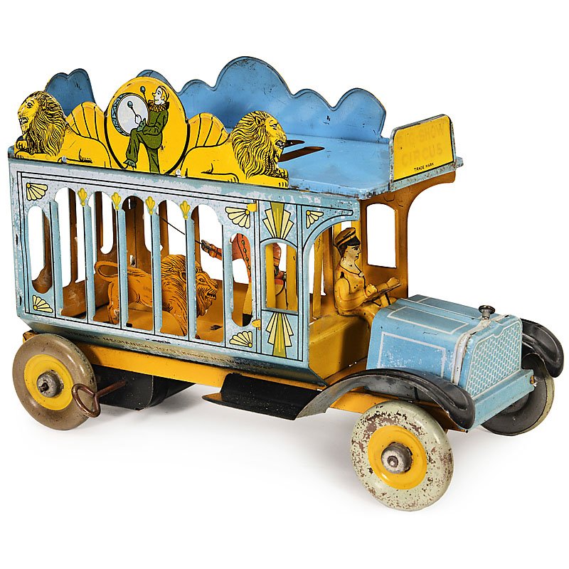 Strauss "Big Show Circus" Truck, c. 1930: Strauss "Big Show Circus" Truck, c. 1930 By "The Ferdinand Strauss Corp", USA, lithographed tin, clockwork (working), with springing lion and tamer, length 11 in. Zirkuskäfigwagen "Big Show Circus", 