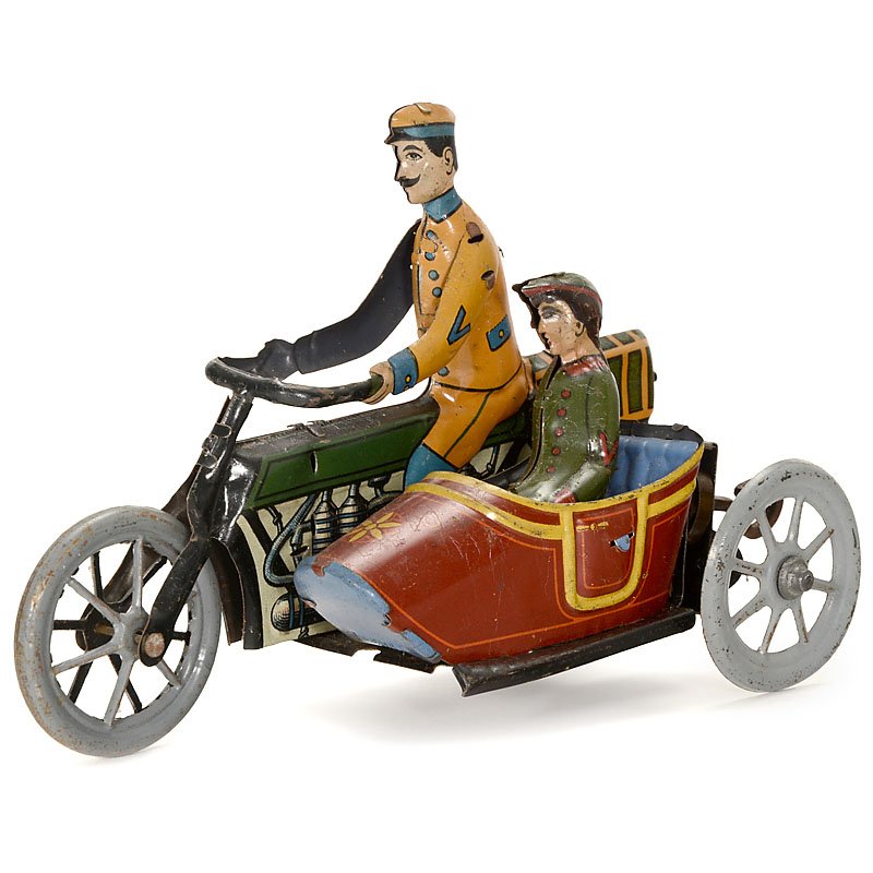 Distler Motorcycle with Sidecar, c. 1920: Distler Motorcycle with Sidecar, c. 1920 Johann Distler KG, Nuremberg. Lithographed tin, clockwork, working, length 6 1/3 in., very rare. Motorrad mit Beiwagen "Distler", um 1920 Johann Distler KG, N�