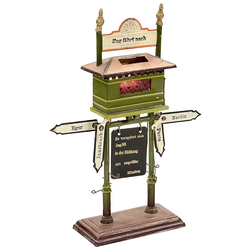 Märklin Destination Sign, c. 1915: Märklin Destination Sign, c. 1915 Hand-painted tin, 4 adjustable signs, delay indicator, top section for candle illumination, height 10 ¼ in. Märklin Fahrtrichtungs- und Verspätungs anzeiger, um 1