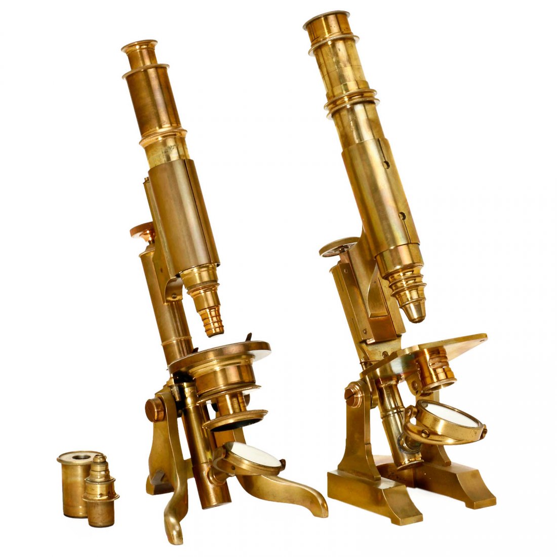 2 Brass Compound Microscopes, c. 1875: 2 Brass Compound Microscopes, c. 1875 Both unmarked, patinated brass, with draw tube and fine adjustment. 1) Condenser sleeve under the round stage, height 13 1/3 in. – And: 2) Square stage, 2 objec