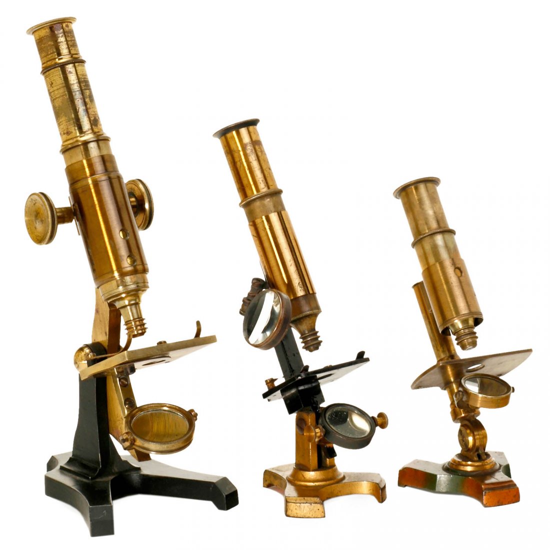3 Brass Compound Microscopes, 1860–80: 3 Brass Compound Microscopes, 1860–80 Unsigned instruments, original lacquered brass, japanned iron bases, tilting stands, single mirrors, one with bull's eye magnifier, one with rack-and-pinion foc