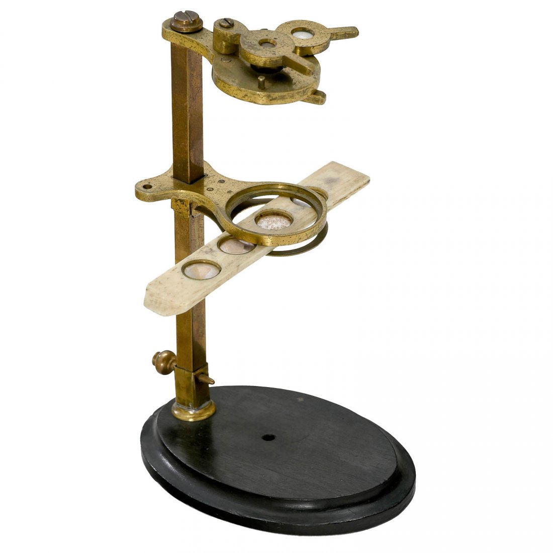Small Botanical Microscope, c. 1770: Small Botanical Microscope, c. 1770 Simple dissecting instrument, lacquered brass, on oval ebony base, focusing with sliding stage, 2 lenses (for single or combination use) screwed to the lens carrier