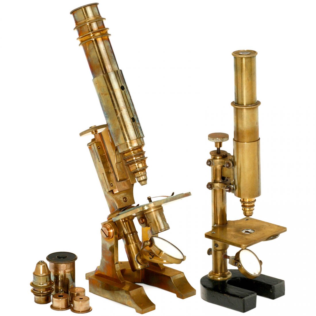 2 Brass Compound Microscopes, c. 1880: 2 Brass Compound Microscopes, c. 1880 Unsigned, patinated brass. 1) Double-mirror, tilting stand, double draw tube, fine adjustment, 2 objectives, 2 oculars, height 12 ½ in., in fitted mahogany case.