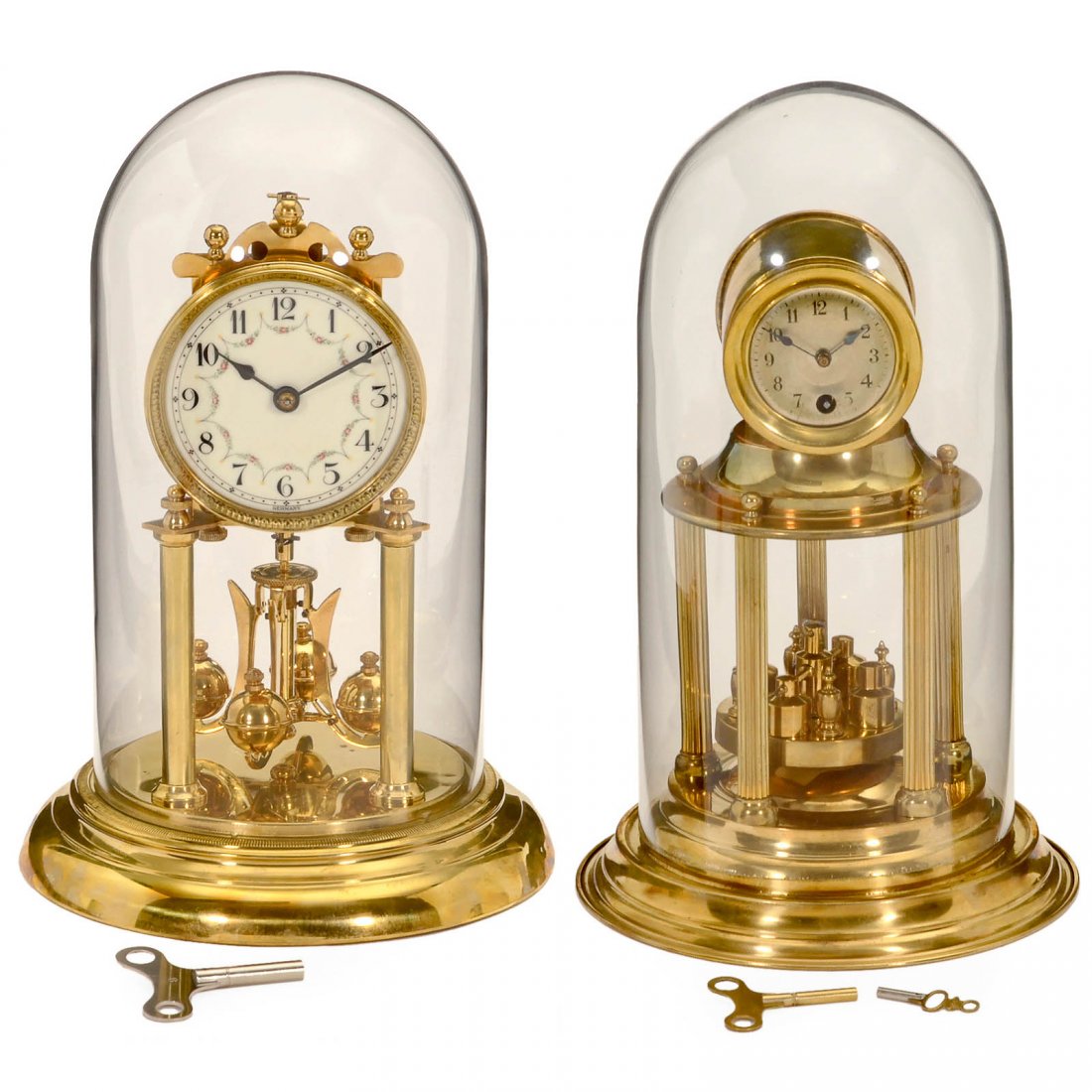 2 German Torsion Pendulum Clock, c. 1920: 2 German Torsion Pendulum Clock, c. 1920 1) Anniversary clock, probably by Vossler, brass, five-post domed, with 2 keys, height 10 ½ in., under glass dome, working. – And: 2) Unmarked, ornated ena