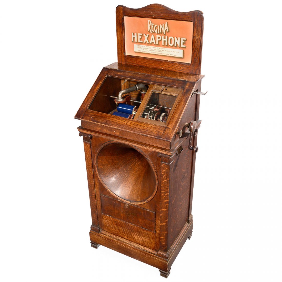 Regina Hexaphone Coin-Operated Phonograph, c. 1915: Regina Hexaphone Coin-Operated Phonograph, c. 1915 Model 104, manufactured by "Regina Co. of Rahway, USA", for 6 selectable cylinders, in oak case with lateral coin-slot and handcrank. Excellent and c