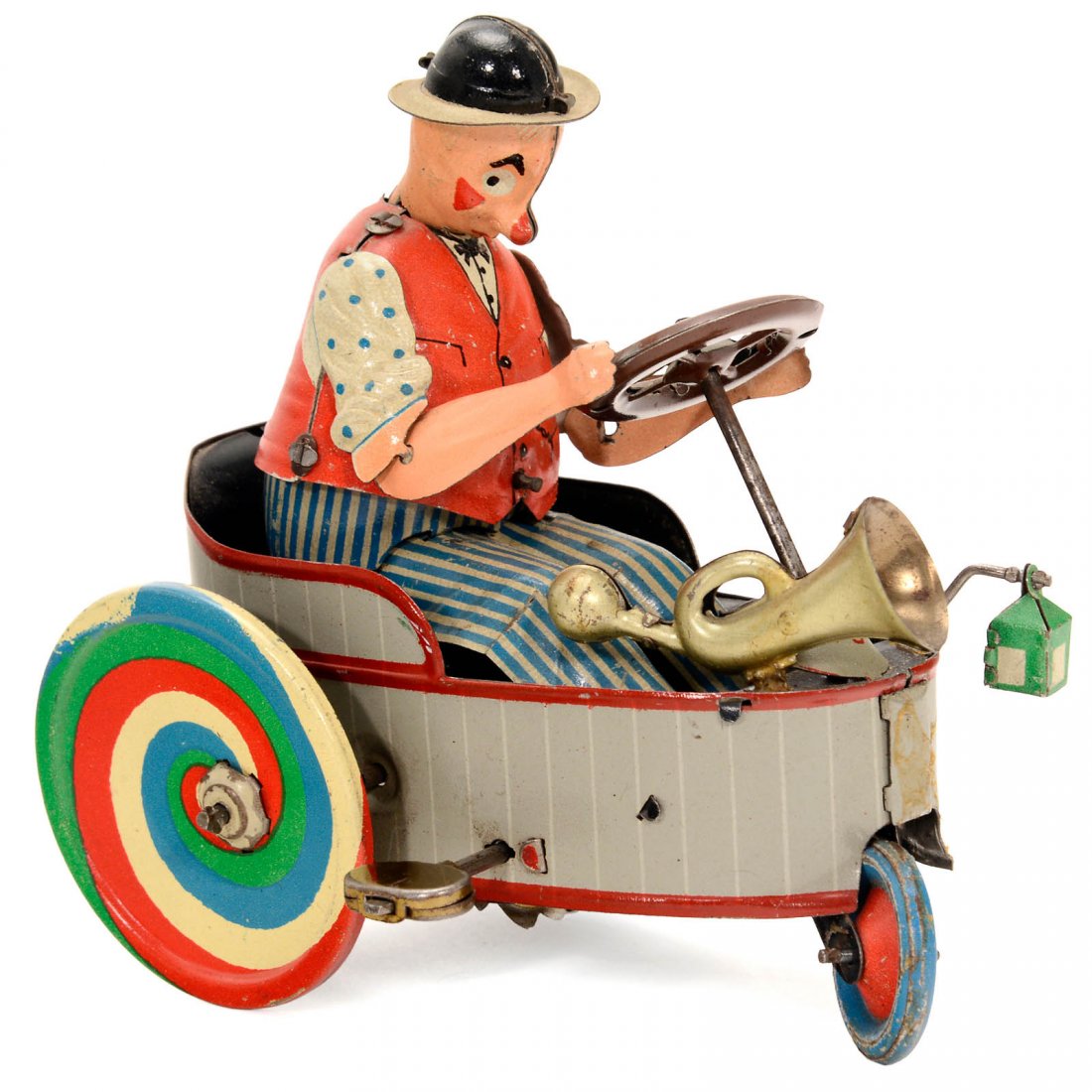Peter Clown Cart No. 503, c. 1935: Peter Clown Cart No. 503, c. 1935 Lithographed tin, spiral spring drive, working, complete with lantern and horn, length 4 ½ in. This cart bears a close resemblance to the "Mixtum" toy EPL 775 made b