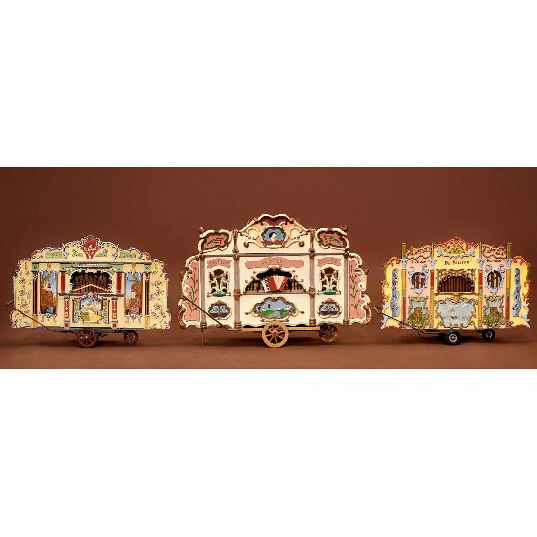 3 Models of Dutch Street Organs: 3 Models of Dutch Street Organs Hand-painted wood, on typical handcarts, marked "De Arabier", "Arnoldi, System Carl Frei" and "De Panter", widths 19 1/3 x 20 x 24 4/5 in. – All organs with several m