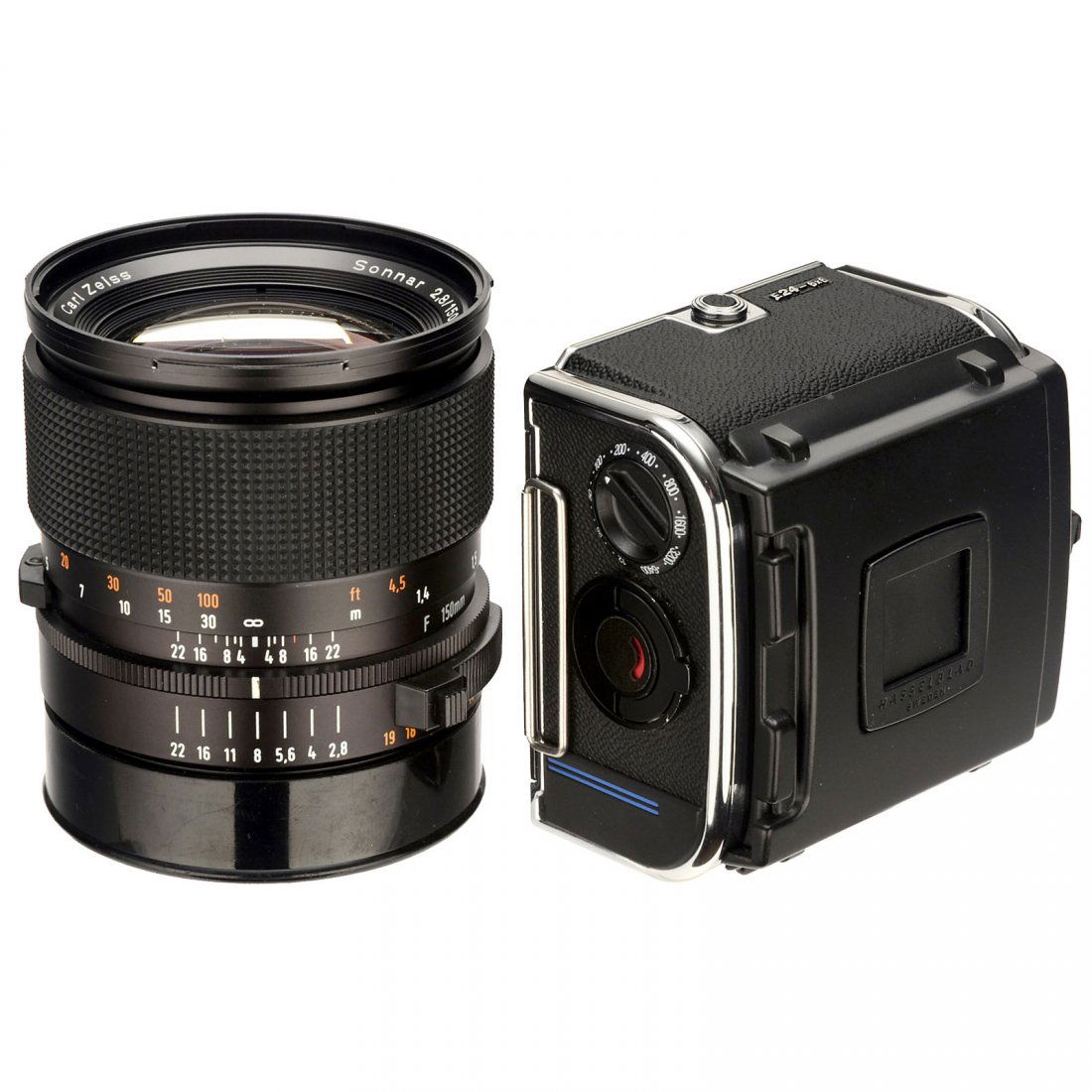 Sonnar TCC-FE 2,8/150 mm T: Sonnar TCC-FE 2,8/150 mm T Hasselblad/Carl Zeiss. Sonnar 2,8/150 mm, no. 6947763, clean body and optics, electric functions not tested, with 2 caps. – And: Hasselblad film magazine E24-6x6, with box