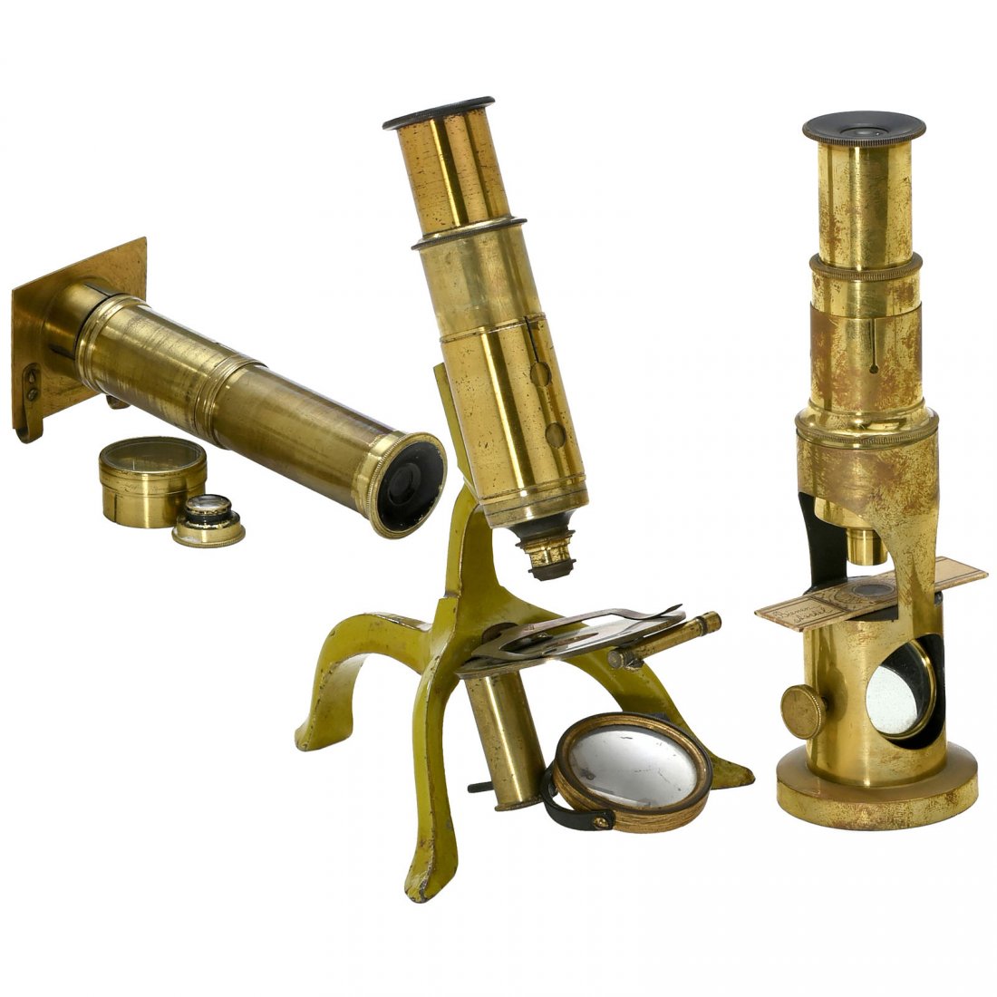 3 Small Brass Microscopes, c. 1885: 3 Small Brass Microscopes, c. 1885 1) Drum microscope, single mirror, draw tube, height 6 ¾ in., in fitted case. – 2) Light-green japanned-iron tripod base, single mirror, draw tube, height 7 in. 