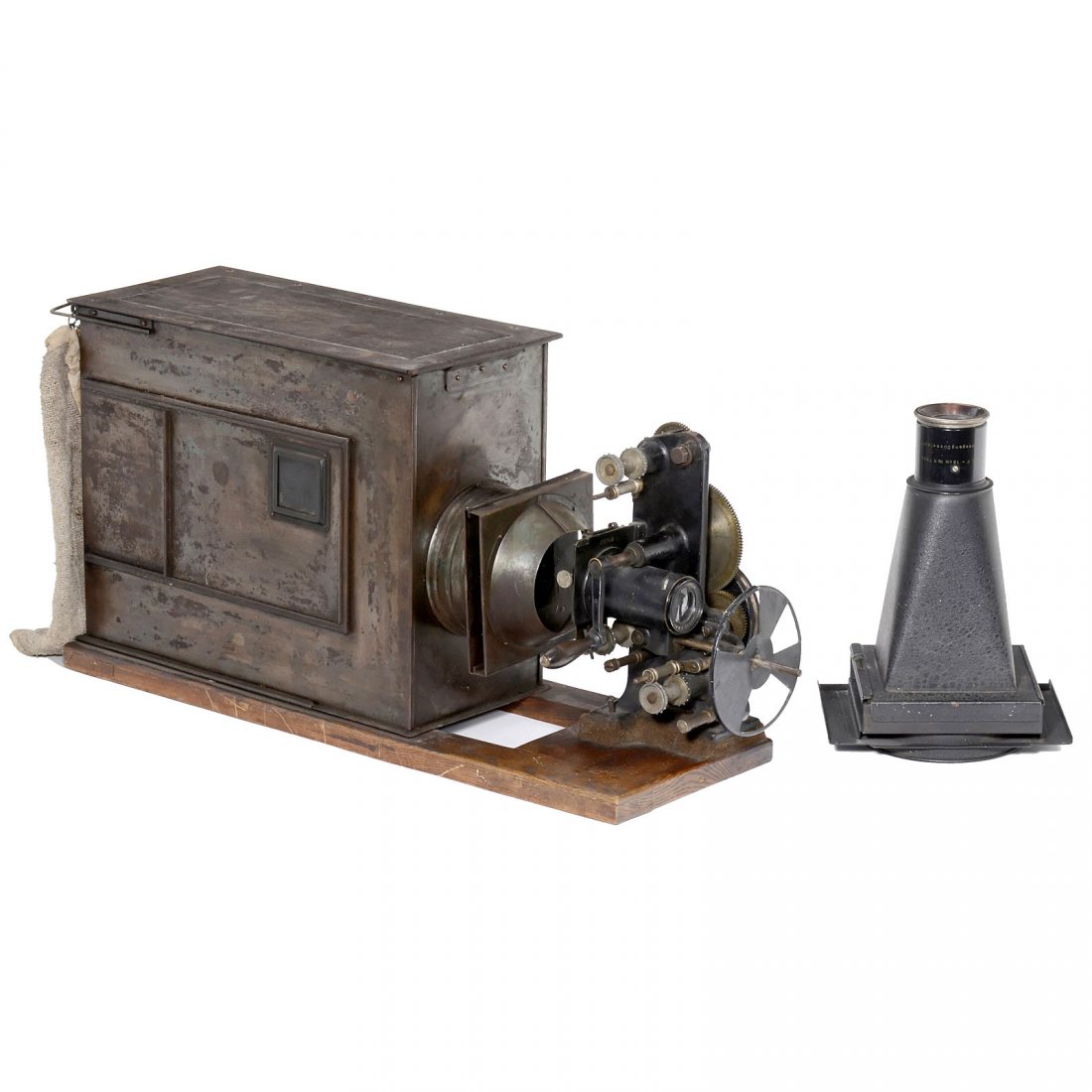 Ernemann 35 mm Table Movie Projector, c. 1910: Ernemann 35 mm Table Movie Projector, c. 1910 Ernemann AG, Dresden. Tin body on wooden base, for 35 mm film and glass slides, 2 lenses "Voigtländer Projektos v 60 mm" and "Liesegang Binal 18 cm", han