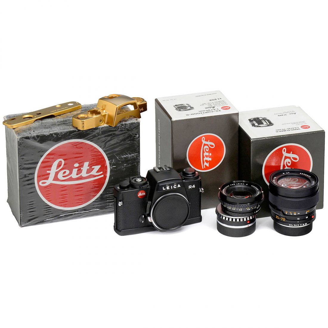 Leica Cameras and Lenses: Leica Cameras and Lenses 1) Leitz, Portugal. Leica R5, chrome, no. 1665096, body. – Unused (original shrink-wrap). (1/–) – 2) Leitz, Portugal. Leica R4, black, no. 1610000, interesting serial nu
