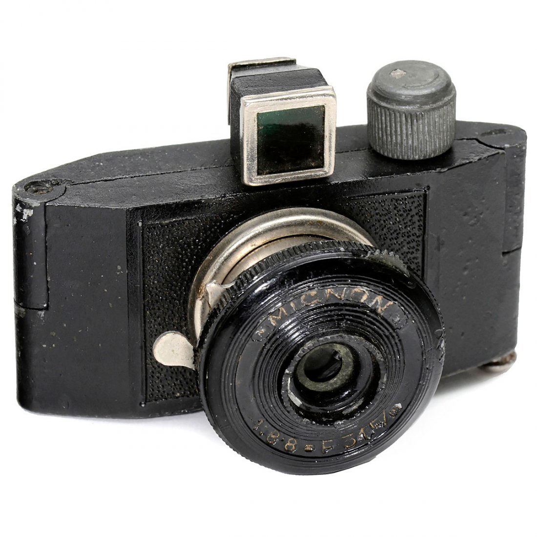 Mignon 20 x 25 mm, c. 1940: Mignon 20 x 25 mm, c. 1940 "Made in Czechoslovakia". Cast-metal miniature camera for 20 x 25 mm on rollfilm, lens 1:8,8/31 mm, shutter I + B, 2 diaphragms. Last auction record at Christie's in Novembe