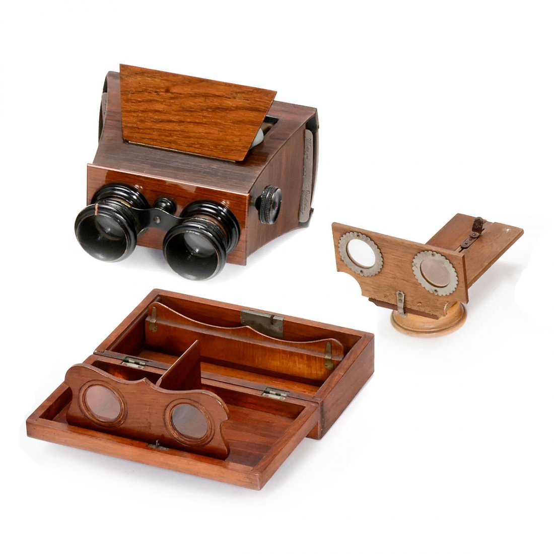 3 Stereo Viewers, c. 1890: 3 Stereo Viewers, c. 1890 1) Unknown manufacturer, binoculars-type stereoscope for cards of 9 x 18 cm, body from precious wood, focusing by rack and pinion, crack in one ocular ring. – 2) Unknown ma