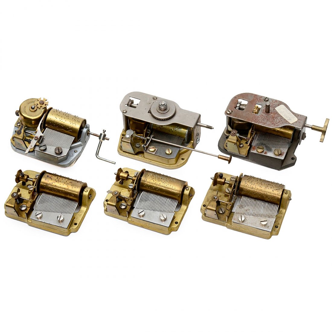 6 Musical Movements for Mechanical Toys or Automata: 6 Musical Movements for Mechanical Toys or Automata Three thirty-note springless movements stamped "M 303", (one missing a bass tooth); a Reuge 28-note movement with external drive; a Swiss 28-note mo