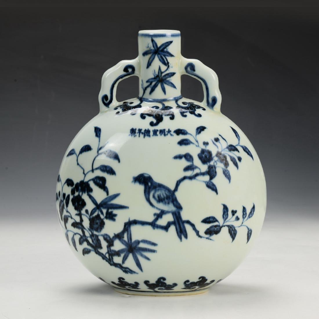 Chinese Blue and Whte Moon Flask Vase: Chinese Blue and Whte Moon Flask Vase, decorated flower and bird pattern, Xuan De mark, good condition; H: 10 1/2 in