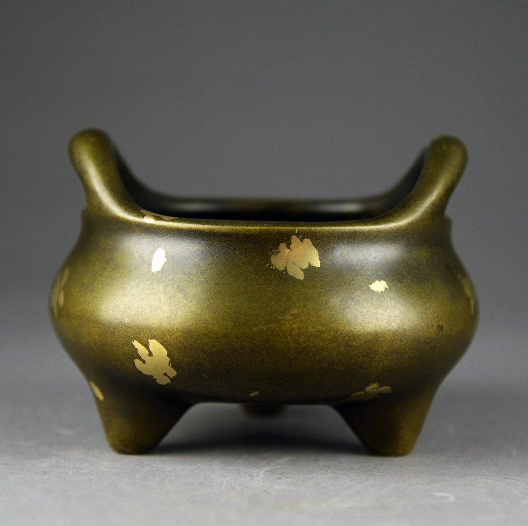 A Copper Censer Marked Xun De of Ming Dynasty: Marked in six Chinese charcters: made in Xunde Ming dynasty, good shaped and enchased with gold boxes. H:5.5"