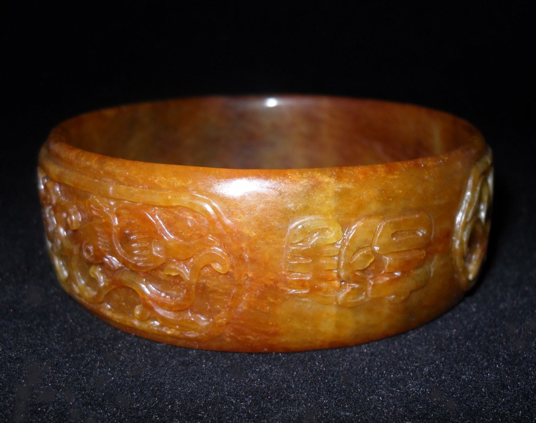 CHINESE JADEITE BRACELET: Chinese bangle with orange yellow brown hue D: 3.5 IN