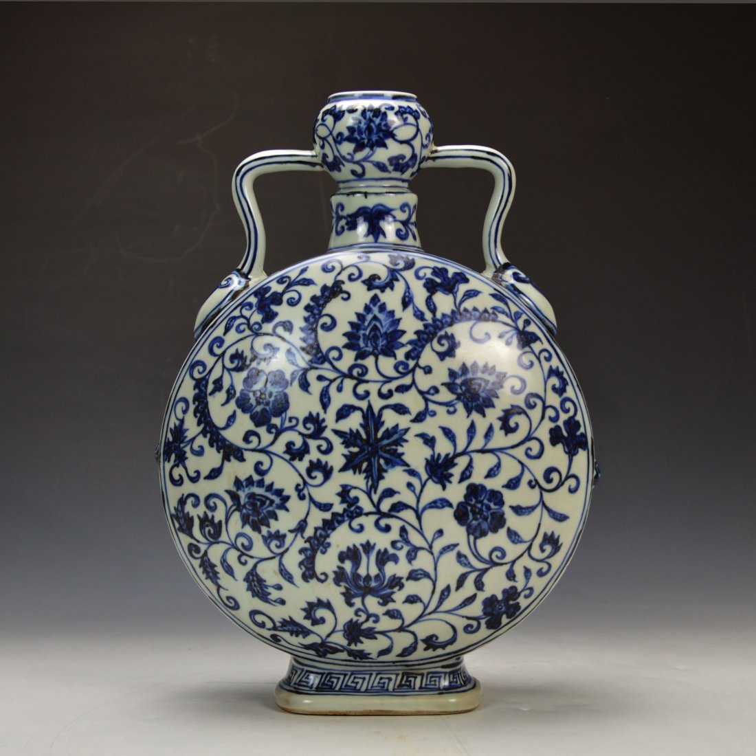 Chinese Blue and White Moon Flask: Chinese Blue and White Moon Flask,decorated with floral motifs, in good condition; H: 11 in