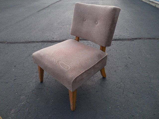 Gilbert Rhode art deco birch wood slipper chair: Gilbert Rhode Art Deco period sculptural slipper chair. Featuring an iconic stream line design with slightly rounded back and canted angle cut solid birch wood legs. Retaining the original spring seat