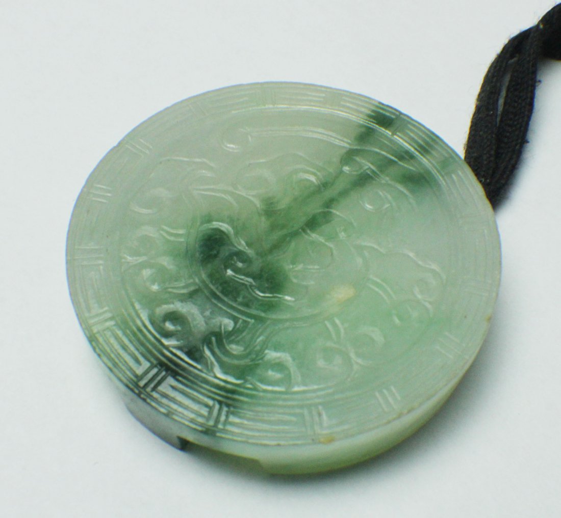 A Jadeite Round Hook Carved in Ruyi from Qing Dynasty (1 of 6)