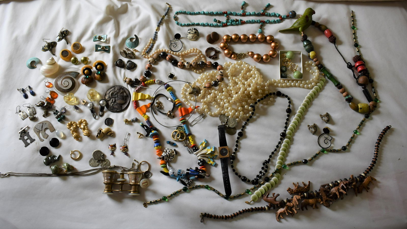 Vintage 1950’s to 1980’s Jewelry Lot: including the greatest show on earth necklace and Fabrice lucite nautilus shell pin.