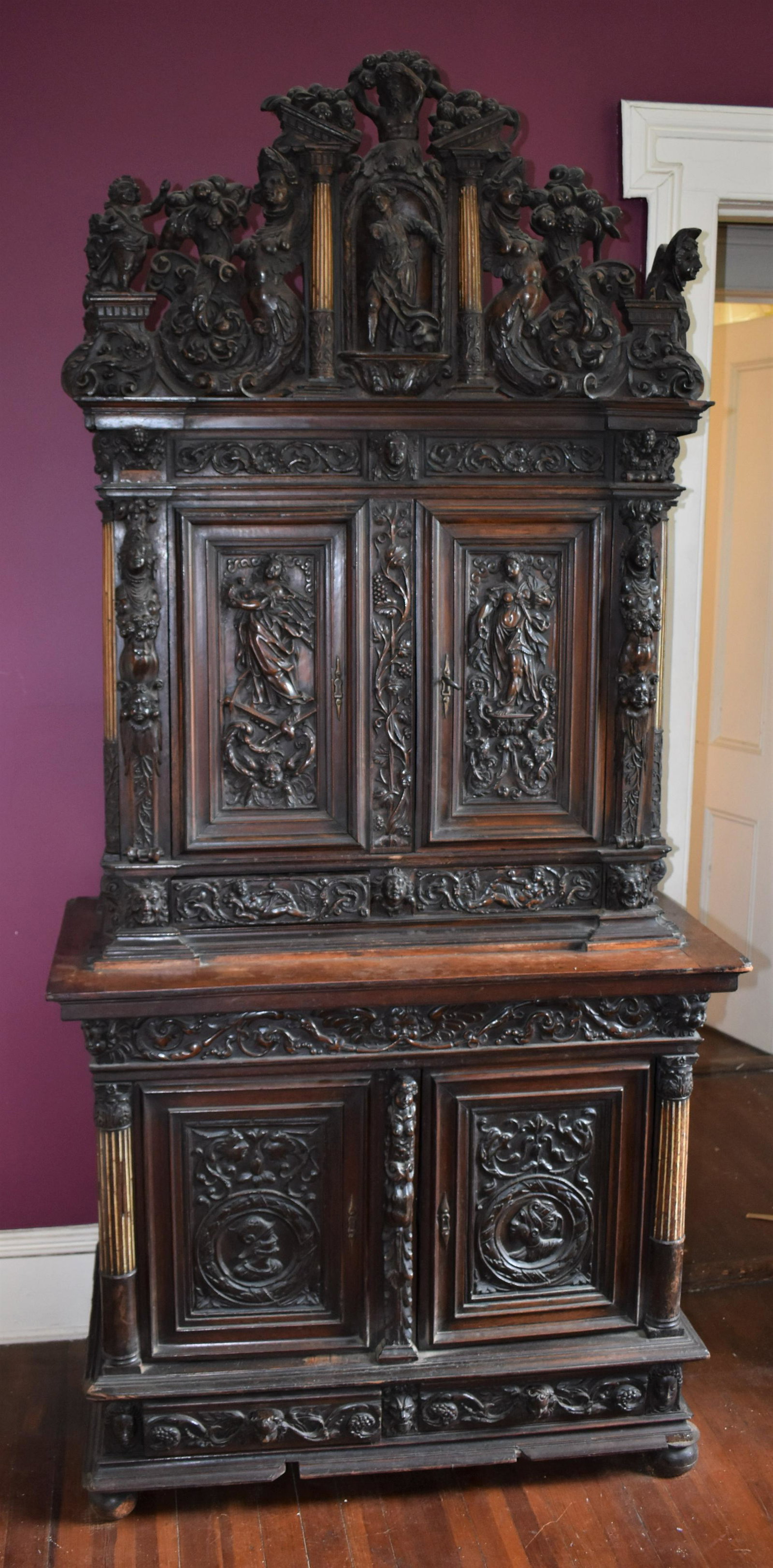 Exceptional French Baroque Burgundy Wedding Cabinet: from the Loire Valley. A related cabinet is in the collection of the Metropolitan Museum of Art. Height 85" Width 40" Depth 19 1/2"