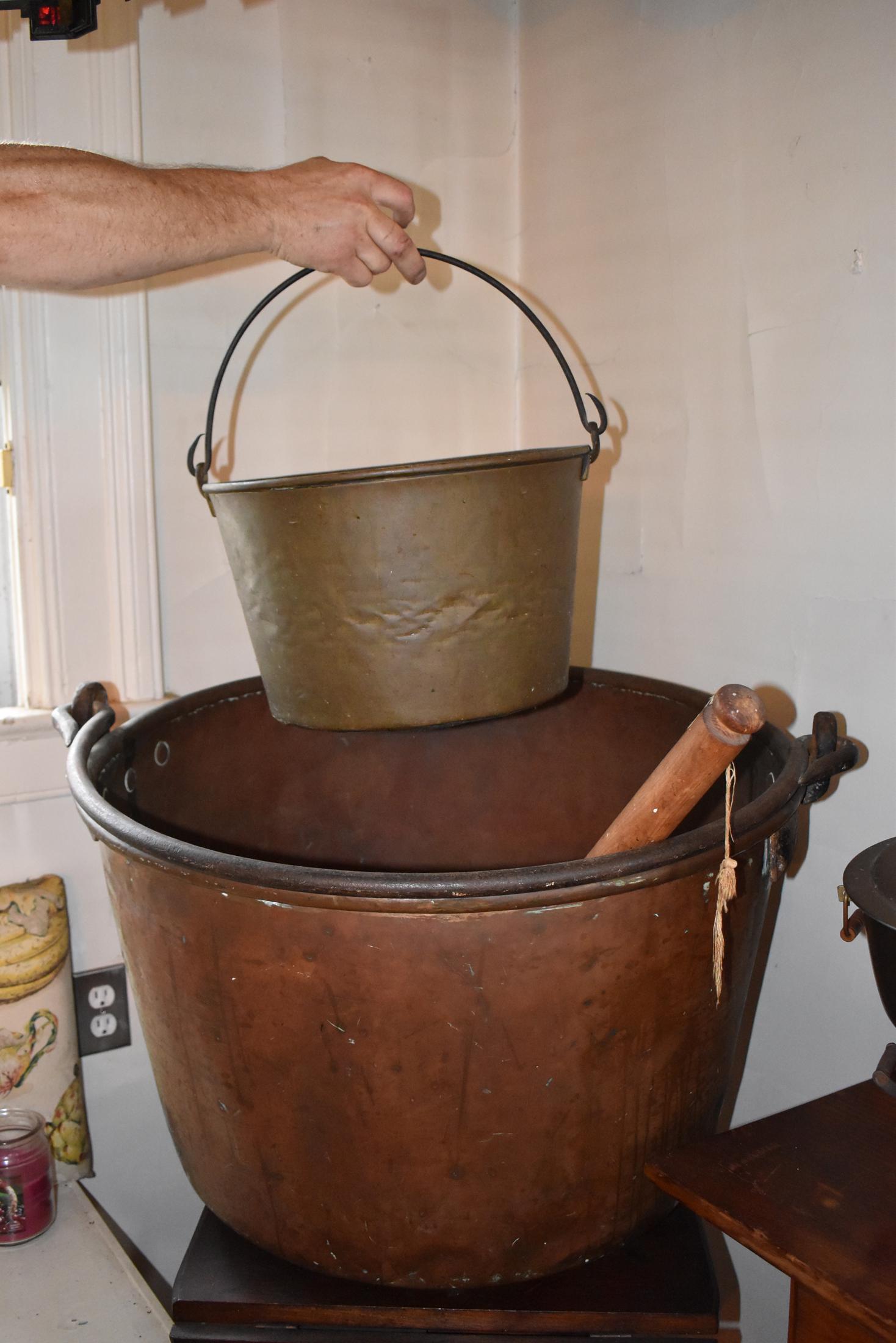 19th Century Pennsylvania apple butter kettle: along with a Connecticut spun brass bucket with swinging bale handle. Height 20" Diameter 27 1/2"