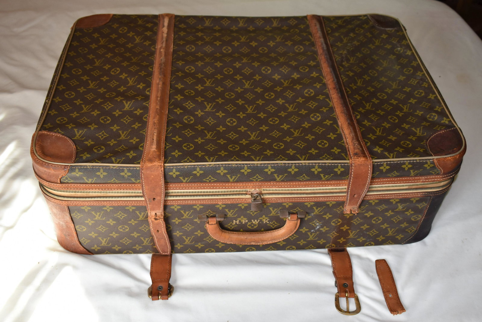 Louis Vuitton Soft Suitcase: monogram HWPK, wear commensurate with age and use. 1 leather strap broken but present. 10 ½” x 31” x 20”