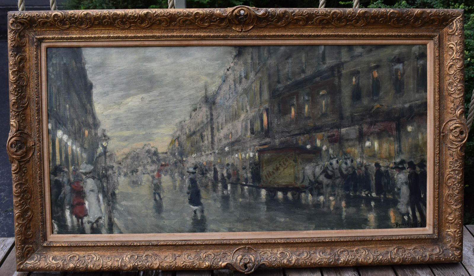 Antal Berkes (1874-1938), Parisian Street Scene: oil on canvas signed lower right Berkes 1913 In a linen lined period gilt carved frame. Sight size 17 3/4" x 39 3/4" Overall : 26 1/2" x 46"