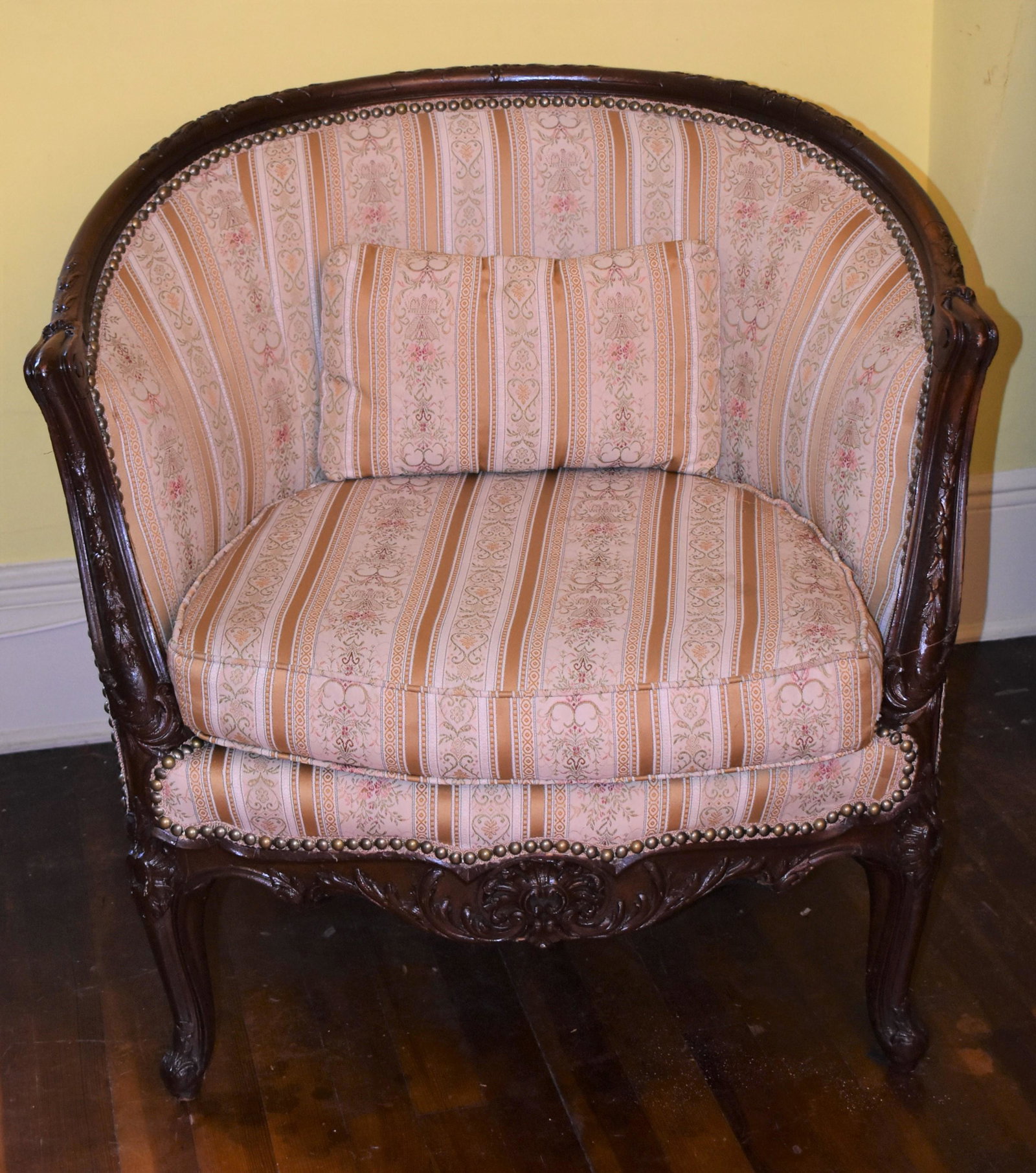 Louis XIV Style Hand Carved Walnut Bergere: with striped silk upholstery. Height 39” Width 52” Depth 30 ½”