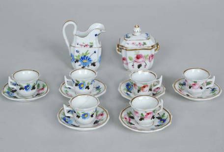 19th C. Porcelain Dolls Tea Service: 19th C. Porcelain Dolls Tea Service consisting of pitcher, covered sugar, six cups and saucers all with hand painted floral and gilt decorated bodies.