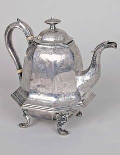 J. & I. Cox New York Coin Silver Teapot: J. & I. Cox New York Coin Silver Teapot, of unusual octagonal bell formed design with intricate floral chasing, hinged domed lid, strap work hollow handle and faceted spout on four scroll formed