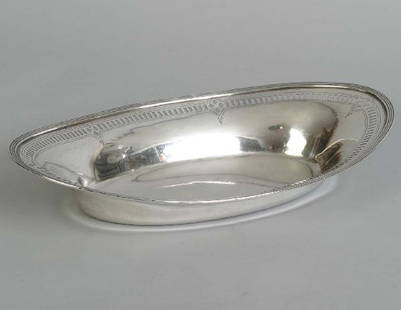 Tiffany & Co. Sterling Oval Bread Tray, 10 T. O.: Tiffany & Co. Sterling Oval Bread Tray, 10 T. O. reeded rim with reticulated banded design. 11 1/2" X 6 3/4" Marked on base: "Tiffany & Co. 17780A Makers 7424" Weight 10 Troy oz.