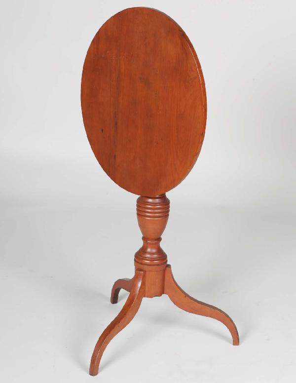 Early 19th C. Baltimore Cherry Candlestand,: Early 19th C. Baltimore Cherry Candlestand, tilting oval top above bold turned ring and reeded vase form shaft, three arched spider legs. Height 28.5" Top 20.75" X 17"