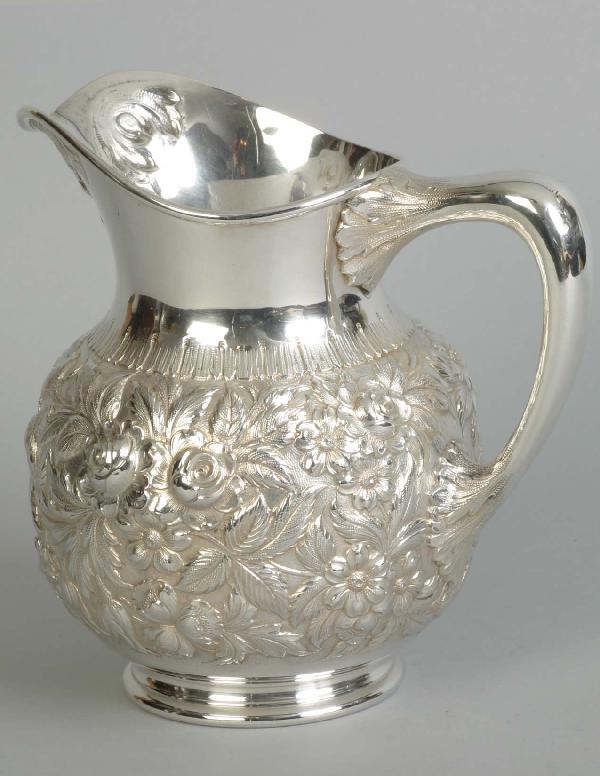 S. Kirk & Sons Sterling Water Pitcher 23.9 T. O., : S. Kirk & Sons Sterling Water Pitcher 23.9 T. O., acanthus leaf repousee spout and floral body. Molded circular foot. Ht. 8 1/4"