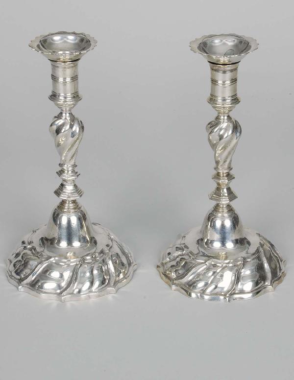 Pair Of 18th C. Cont. Rococo Silver Candlesticks: Pair Of 18th C. Cont. Rococo Silver Candlesticks of elaborate design with cyma formed circular bobeche, the two part cast shaft of ring, spiral baluster & octagonal faceted design, on a hand raised ci