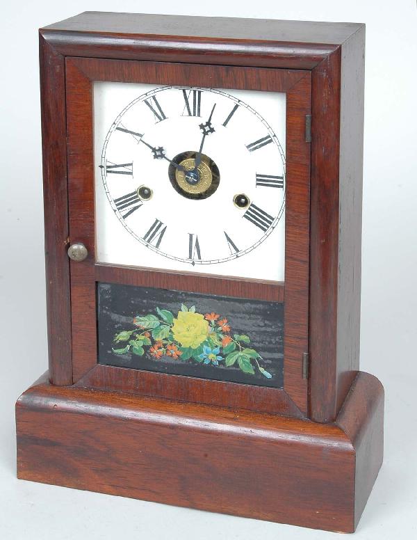 19th C. Seth Thomas Rosewood Shelf Clock: 19th C. Seth Thomas Rosewood Shelf Clock of rectangular form having hinged glazed door with lower eglomise tablet opening to a time and strike movement with alarm mechanism, original label & key. Heig