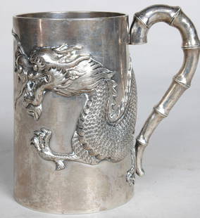 CHINESE EXPORT SILVER CANN, bamboo strap work hand: CHINESE EXPORT SILVER CANN, bamboo strap work handle, cylindrical body with ornate raised dragon decoration, makers mark of Luen-Wo, Shanghai. H. 4" 7.37 Troy Oz.