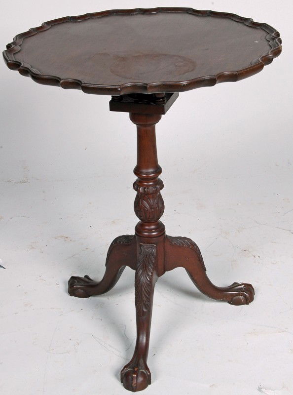 19TH C. CHIPPENDALE MAHOGANY PIE CRUST TEA TABLE,: 19TH C. CHIPPENDALE MAHOGANY PIE CRUST TEA TABLE, of diminutive proportion, the pie crust top tilting and rotating above a square birdcage mechanism, elaborate acanthus carved baluster shaft on three